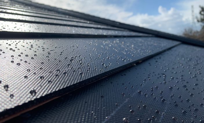 Wet Solar Shingles On A Sunny Day