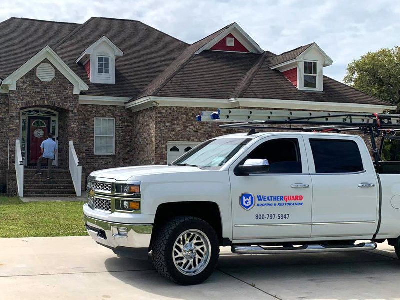 Company Truck By New Roof Home